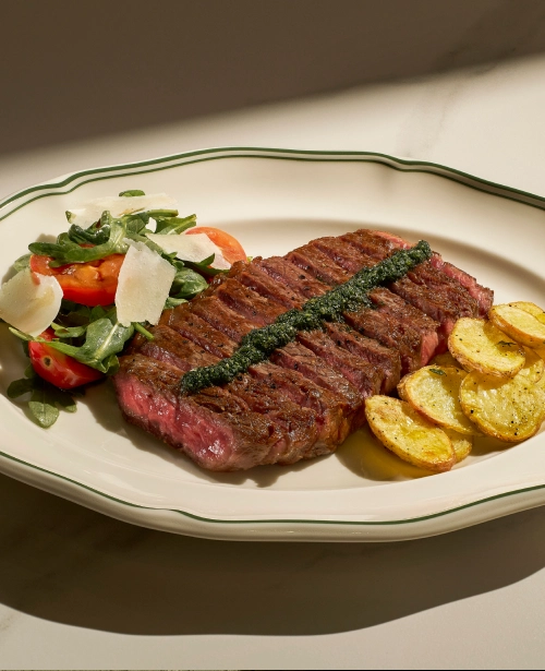 Sliced bistecca with roast potatoes at Osteria Da Su, Telok Ayer
