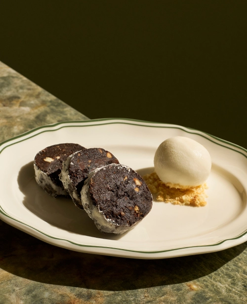 Chocolate salami slices served with gelato