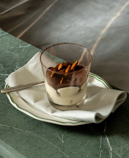 Tiramisu served in a glass with chocolate shavings